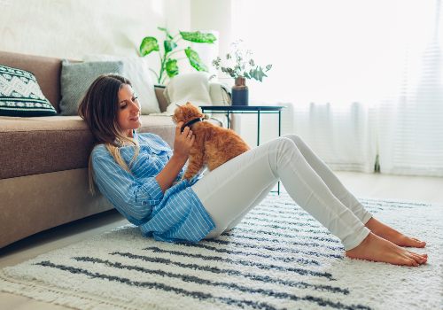 A woman keeping plants less appealing to her cat